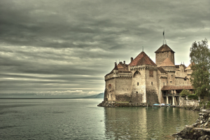 A photo of a castle by a lake taken on someone's vacation used to remind us of the need to create and maximize our travel budget.