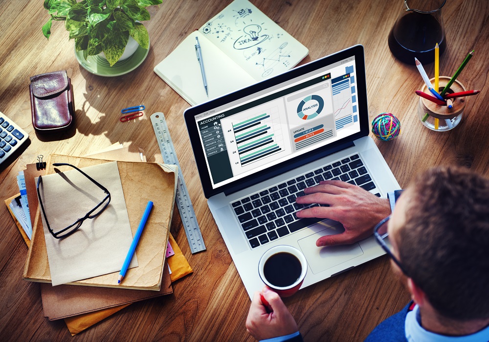 Man organizing his personal finances as part of his spring cleaning plan