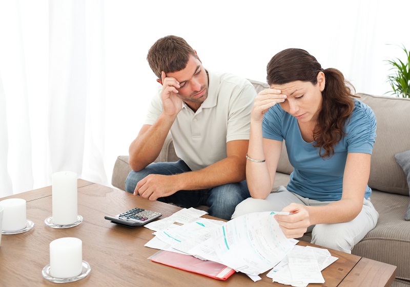 Couple discussing their money mistakes.