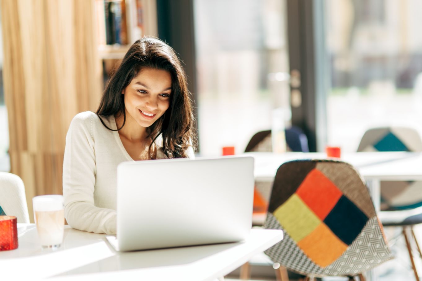 A woman on a laptop trying to separate work from personal time. Time is money and it's good to use both wisely.