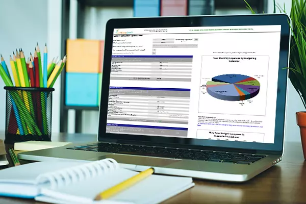 A laptop showing the best budget calculator spreadsheet for Excel.