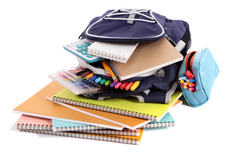 A backpack with lots of school supplies representing back to school shopping.